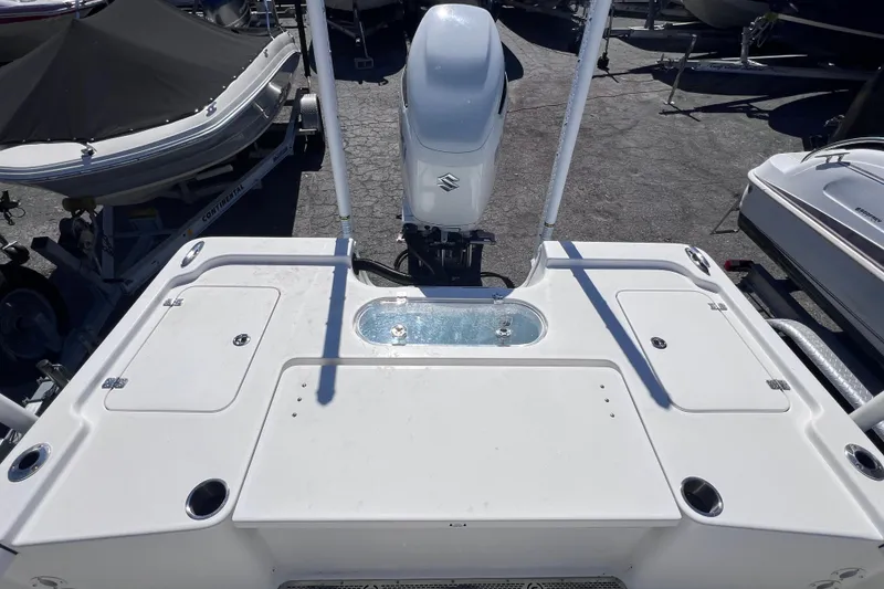 Slide: The Image of 2023 Sea Pro 248 Bay boat deck with Suzuki outboard motor. - 15