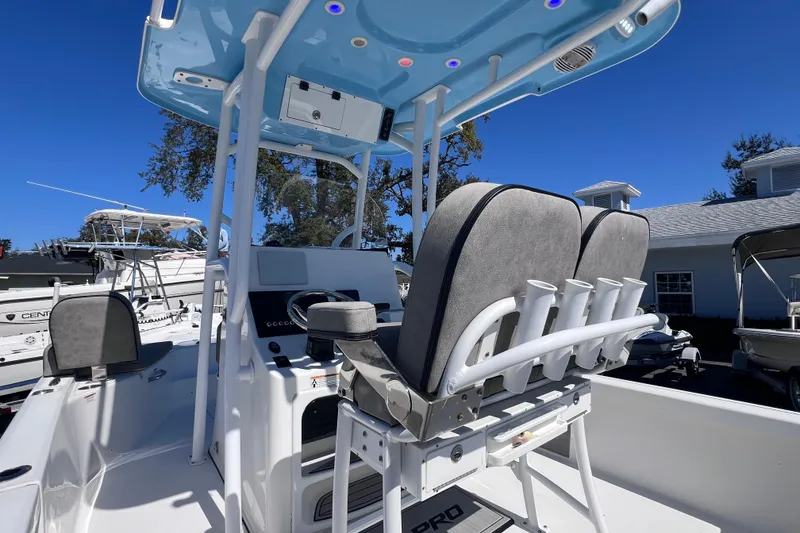 Slide: The Image of 2023 Sea Pro 248 Bay boat interior with seating and rod holders. - 19