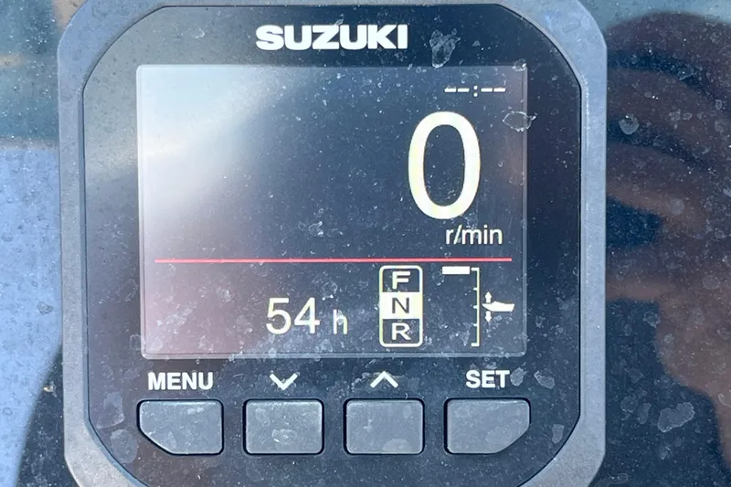 Slide: The Image of Suzuki engine display on 2023 Sea Pro 248 Bay boat, showing 54 hours. - 28