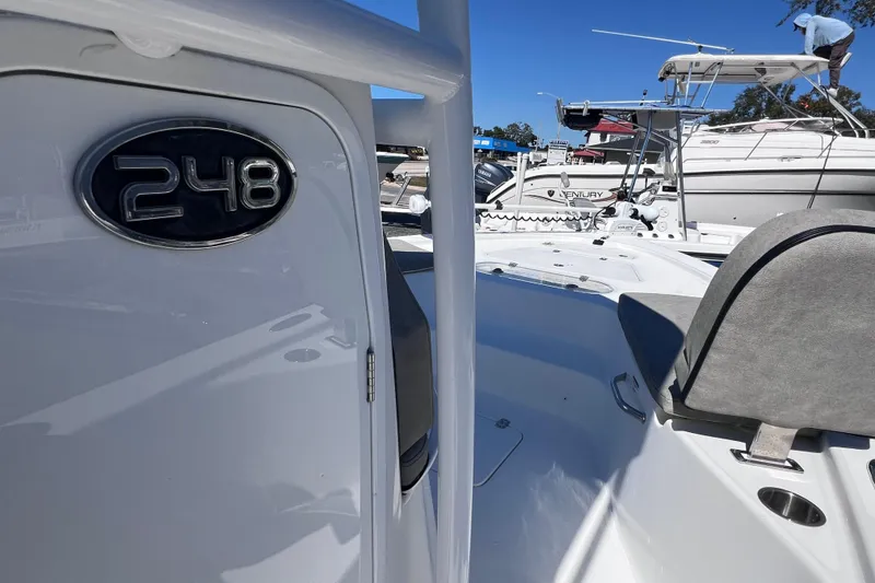 Slide: The Image of 2023 Sea Pro 248 Bay boat, showcasing sleek design and seating area. - 33