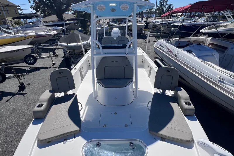 Slide: The Image of 2023 Sea Pro 248 Bay boat with seating, displayed in a marina setting. - 34