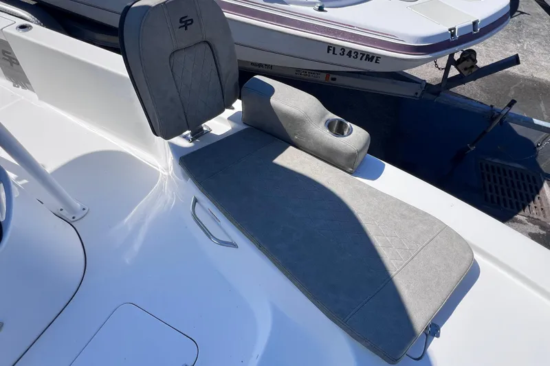 Slide: The Image of 2023 Sea Pro 248 Bay boat seat with cup holder, gray upholstery. - 36