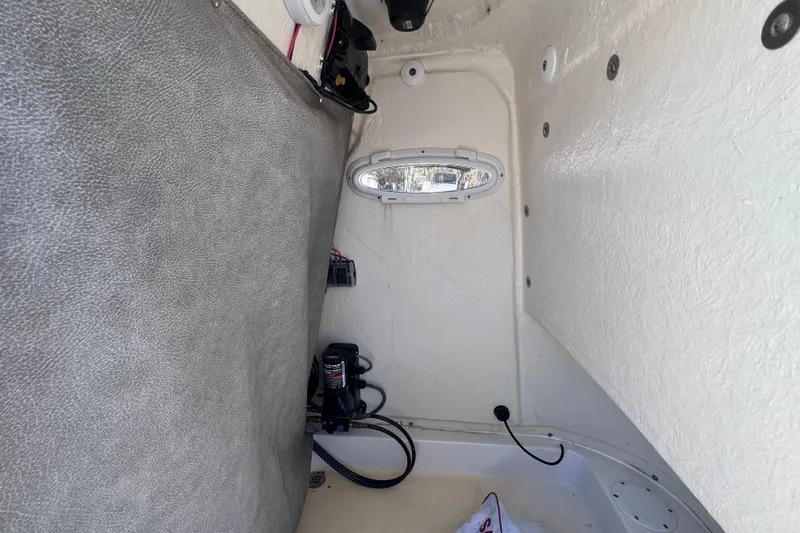 Slide: The Image of Interior view of 2023 Sea Pro 248 Bay boat, featuring equipment and storage space. - 42
