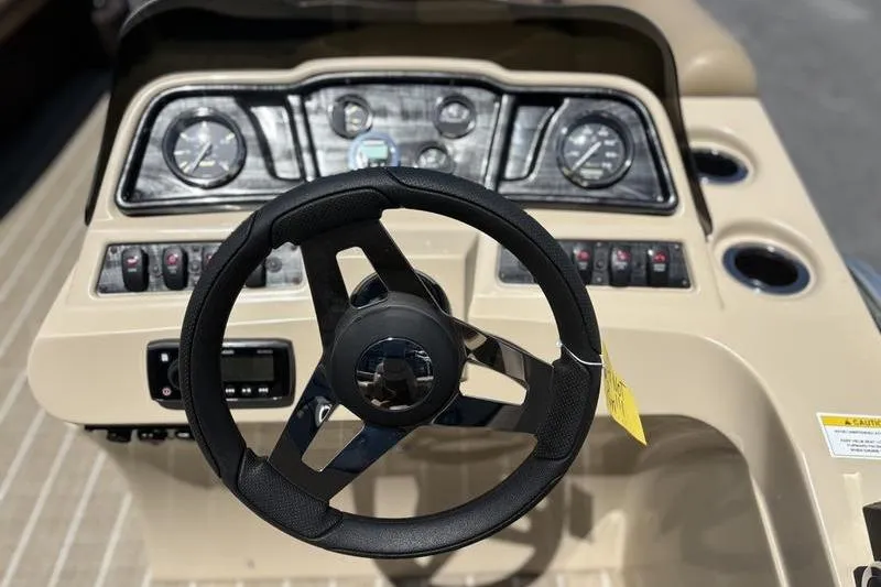 Slide: The Image of Steering console of 2021 Godfrey Sweetwater 2086 C boat with gauges and controls. - 11