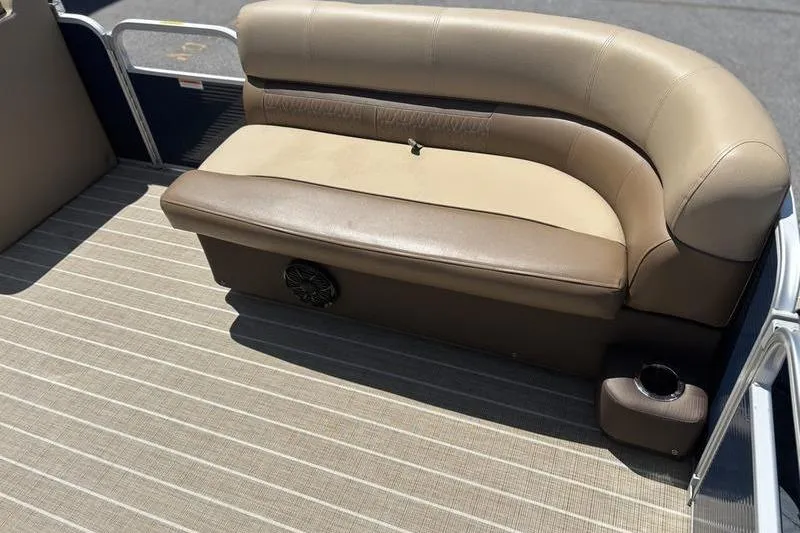 Slide: The Image of 2021 Godfrey Sweetwater 2086 C pontoon boat seating with beige upholstery and cup holder. - 13