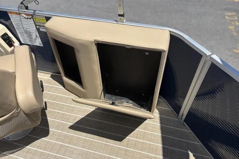 Slide: The Image of 2021 Godfrey Sweetwater 2086 C boat interior with open storage compartment. - 16