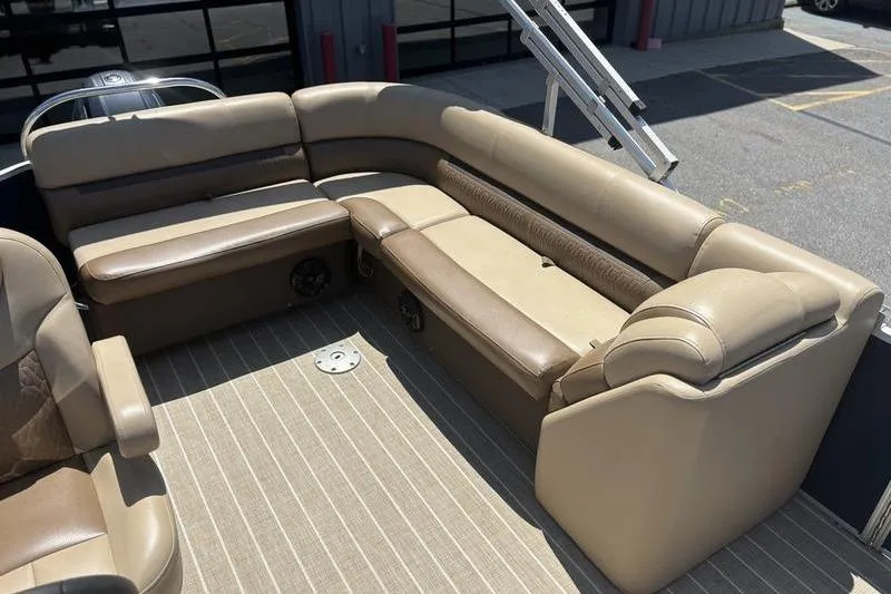 Slide: The Image of 2021 Godfrey Sweetwater 2086 C pontoon boat interior with beige seating and striped flooring. - 18