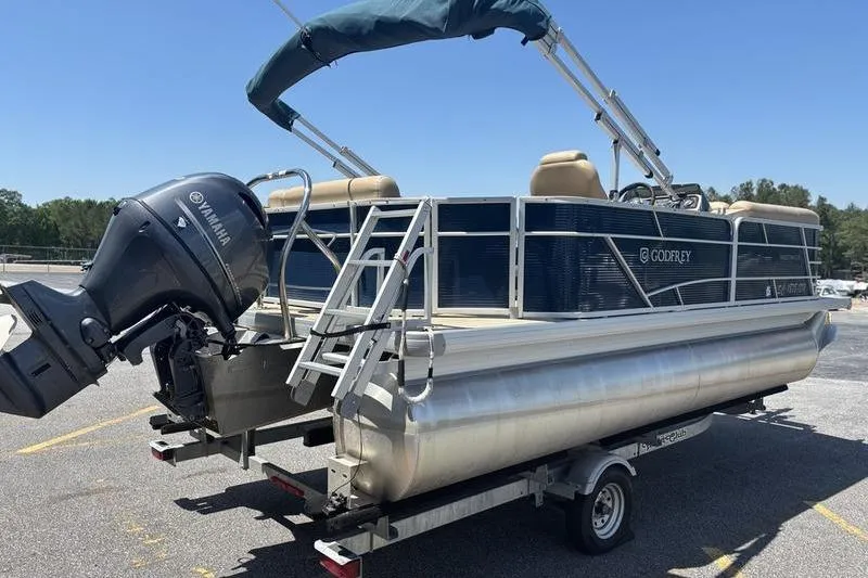 Slide: The Image of 2021 Godfrey Sweetwater 2086 C pontoon boat with Yamaha motor on trailer. - 2
