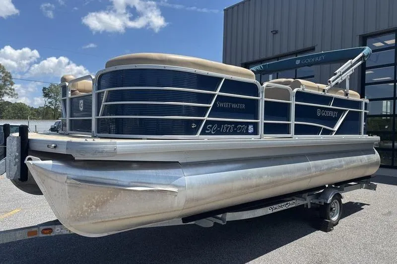 Slide: The Image of 2021 Godfrey Sweetwater 2086 C pontoon boat on trailer, parked outdoors. - 3