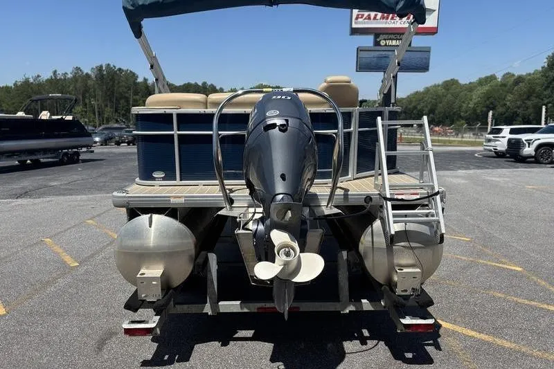Slide: The Image of 2021 Godfrey Sweetwater 2086 C pontoon boat with outboard motor, parked on trailer. - 7