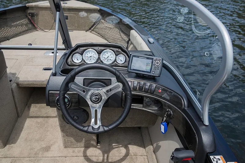 Slide: The Image of Manufacturer Provided Image: 2019 Crestliner 1850 Super Hawk boat dashboard with steering wheel and navigation system. - 11