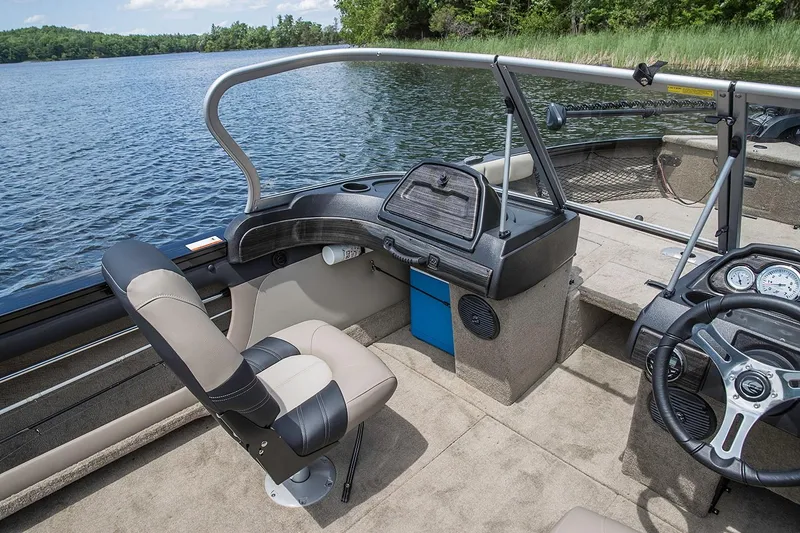 Slide: The Image of Manufacturer Provided Image: 2019 Crestliner 1850 Super Hawk boat interior with captain's chair and dashboard. - 12
