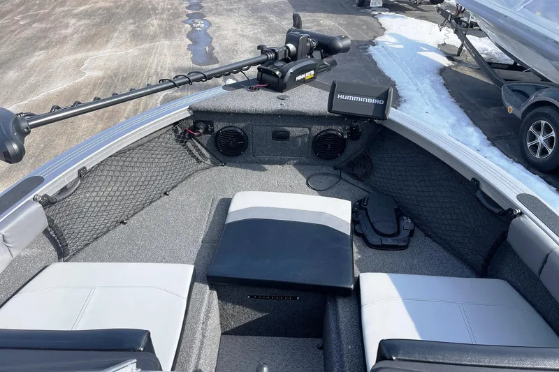 Slide: The Image of 2019 Crestliner 1850 Super Hawk boat interior with Humminbird electronics and trolling motor. - 4