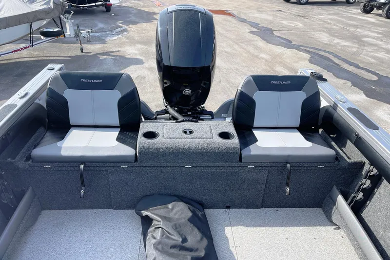 Slide: The Image of 2019 Crestliner 1850 Super Hawk boat interior with dual seats and motor. - 5
