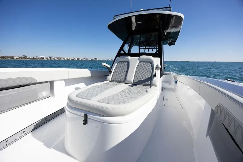 Slide: The Image of 2025 Front Runner 36 Center Console boat on open water, featuring sleek seating and modern design. - 12