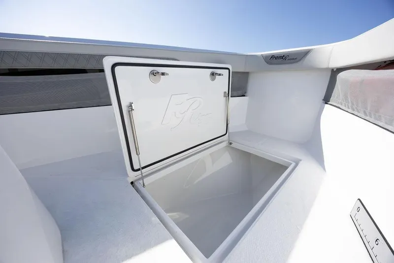 Slide: The Image of Open storage compartment on 2025 Front Runner 36 Center Console boat. - 13