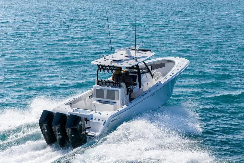Slide: The Image of 2025 Front Runner 36 Center Console boat cruising on open water. - 2
