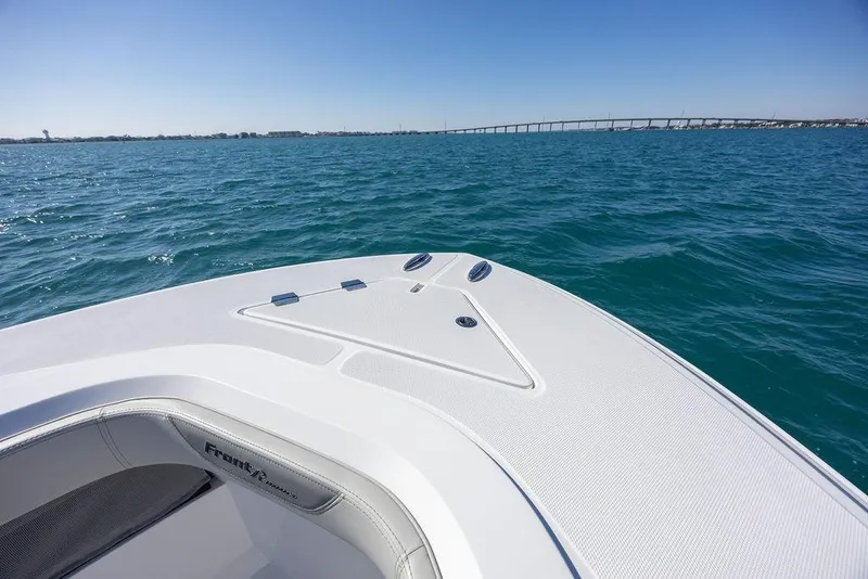 Slide: The Image of 2025 Front Runner 36 Center Console boat on open water with clear blue sky. - 9