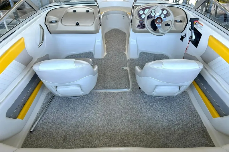 Slide: The Image of 2007 Glastron GT 205 boat interior with dual seats and steering console. - 20