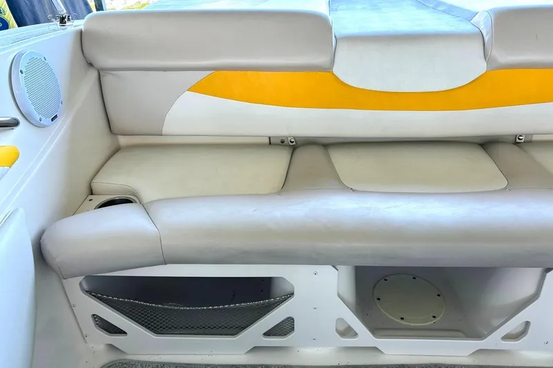 Slide: The Image of 2007 Glastron GT 205 boat interior with gray and yellow seating. - 22