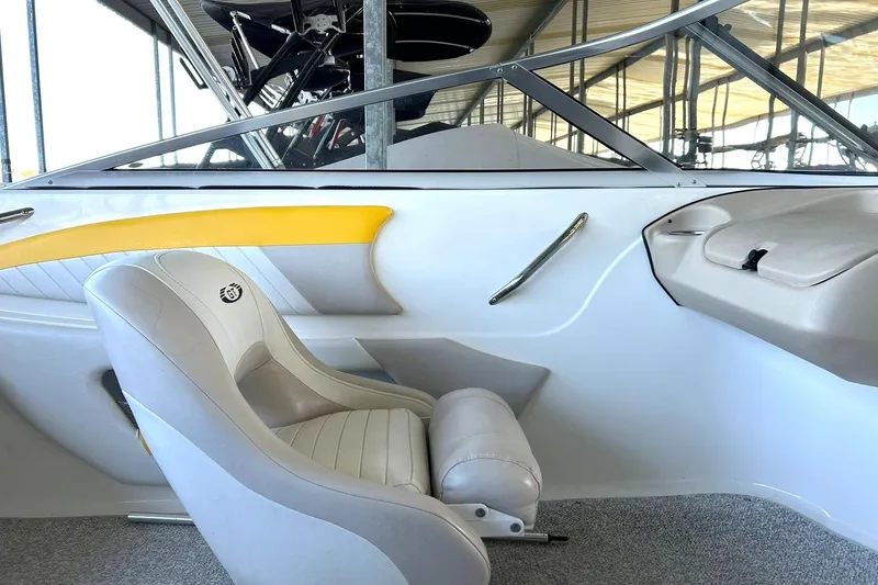 Slide: The Image of 2007 Glastron GT 205 boat interior with white and yellow seating, sleek design. - 25