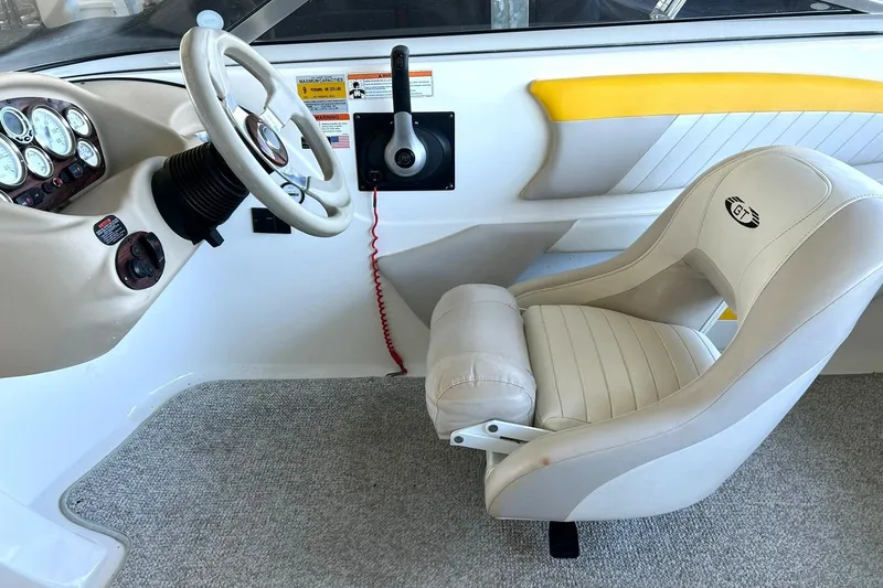 Slide: The Image of 2007 Glastron GT 205 boat interior with steering wheel and captain's seat. - 27