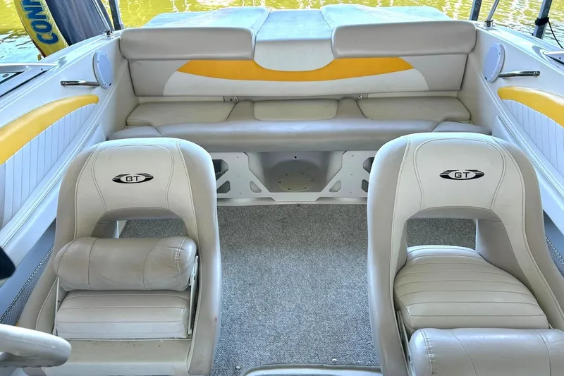 Slide: The Image of 2007 Glastron GT 205 boat interior with beige and yellow seating. - 3