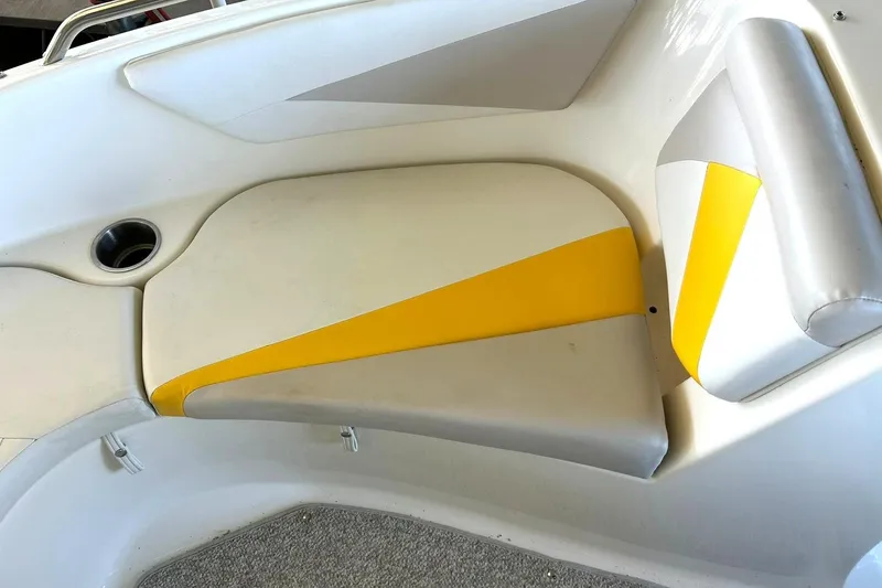 Slide: The Image of 2007 Glastron GT 205 boat interior with yellow and gray seating. - 30