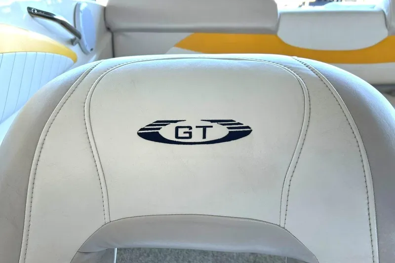 Slide: The Image of 2007 Glastron GT 205 boat seat with embroidered logo, white and yellow interior. - 40
