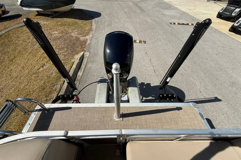 Slide: The Image of 2024 Sun Tracker Party Barge 22 DLX pontoon boat with motor and power poles. - 21