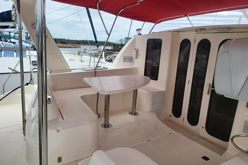 Slide: The Image of Aerial view of a 2000 Leopard 38 catamaran docked at a marina. - 10