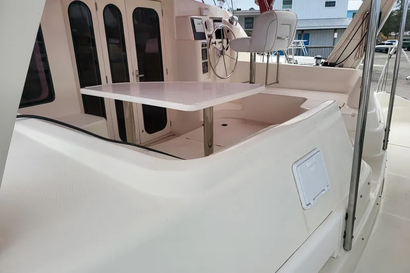 Slide: The Image of Aerial view of a 2000 Leopard 38 catamaran docked at a marina. - 11