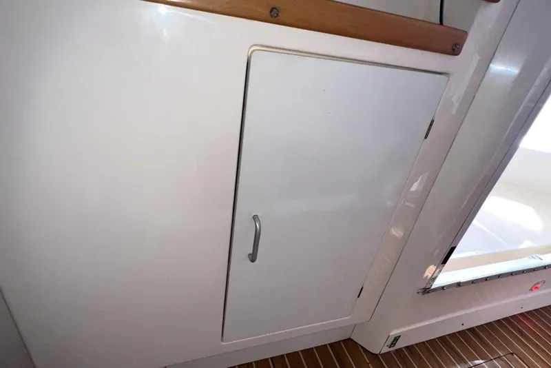 Slide: The Image of White cabinet door on a 2000 Leopard 38 yacht interior. - 111