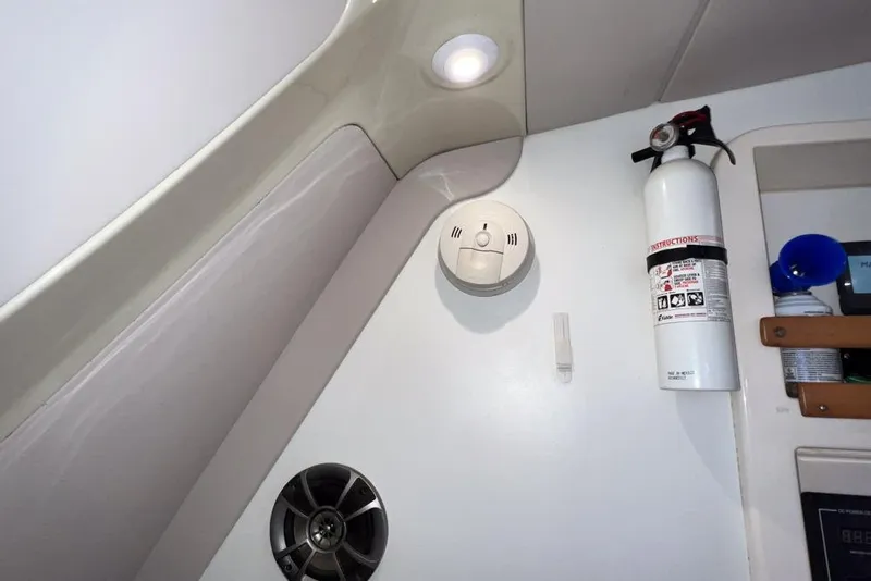 Slide: The Image of Interior of a 2000 Leopard 38 boat with fire extinguisher and smoke detector. - 112