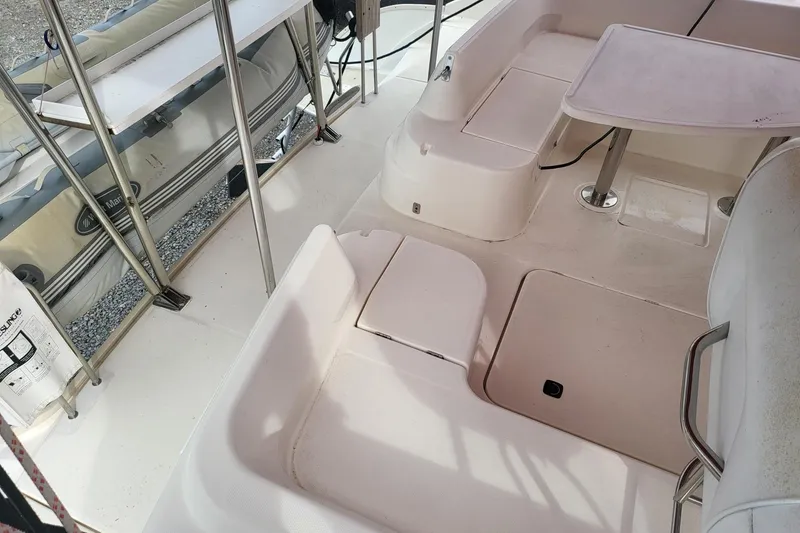 Slide: The Image of Aerial view of a marina with a 2000 Leopard 38 catamaran docked among other boats. - 12