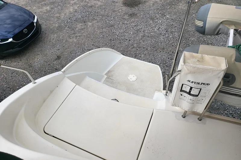 Slide: The Image of Aerial view of a 2000 Leopard 38 catamaran docked among other boats in a marina. - 13