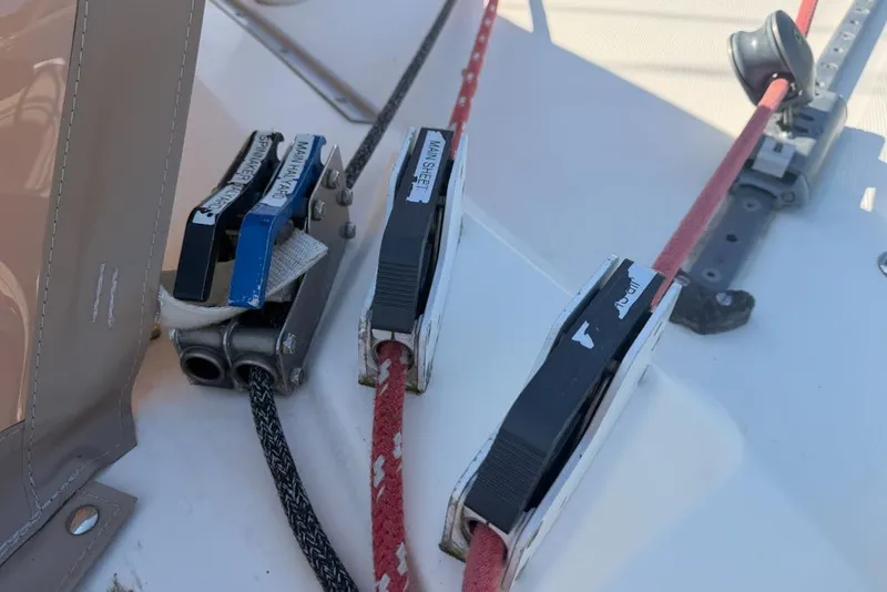 Slide: The Image of Sailing equipment on a 2000 Leopard 38 catamaran, featuring labeled rope clutches. - 130