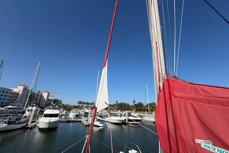 Slide: The Image of Sailboat Leopard 38 (2000) docked in marina with clear blue sky. - 148