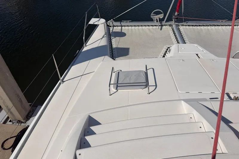 Slide: The Image of Deck view of a 2000 Leopard 38 catamaran, featuring spacious layout and netting. - 150