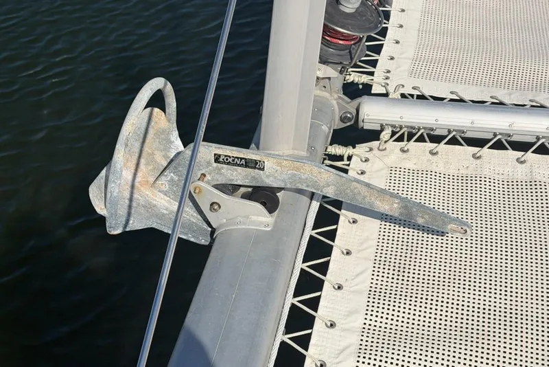 Slide: The Image of Anchor on a 2000 Leopard 38 catamaran, secured on deck near netting. - 162