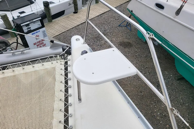 Slide: The Image of Catamaran Leopard 38, 2000 model, docked at marina with surrounding boats. - 21