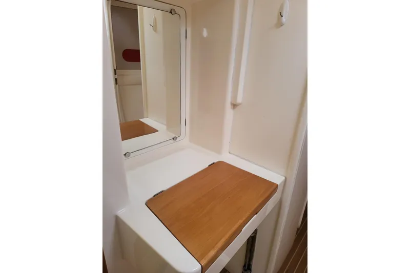 Slide: The Image of Aerial view of boats docked at a marina, featuring a 2000 Leopard 38 catamaran. - 23