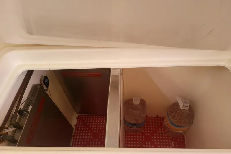 Slide: The Image of Catamaran Leopard 38, 2000 model, docked at marina with surrounding boats. - 28