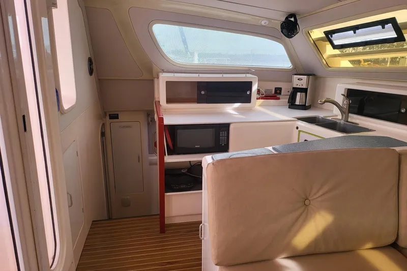 Slide: The Image of Aerial view of a 2000 Leopard 38 catamaran docked at a marina. - 30