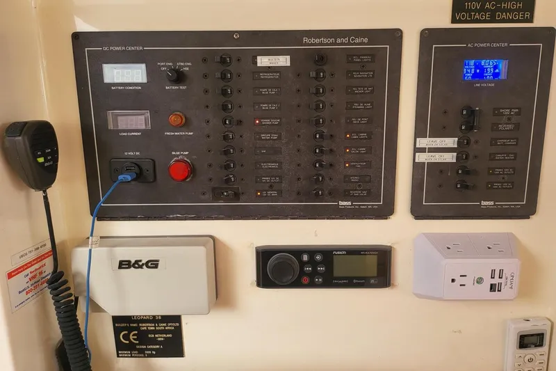 Slide: The Image of Helm station of 2000 Leopard 38 catamaran with covered seat and navigation equipment. - 33