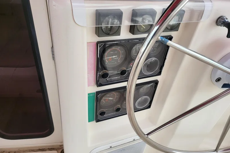 Slide: The Image of Helm of 2000 Leopard 38 catamaran with navigation equipment and steering wheel. - 35