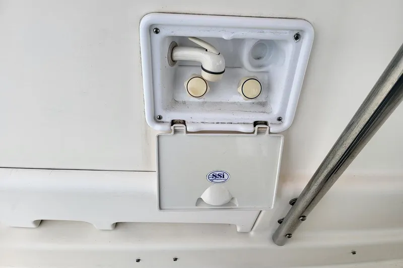 Slide: The Image of Cockpit of a 2000 Leopard 38 catamaran with steering wheel and navigation equipment. - 37