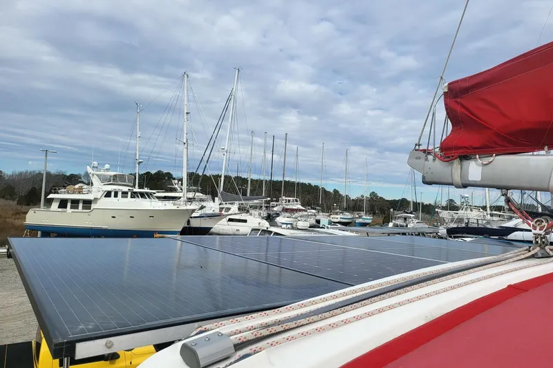 Slide: The Image of Interior view of a 2000 Leopard 38 catamaran, featuring a shaded cockpit and seating area. - 43