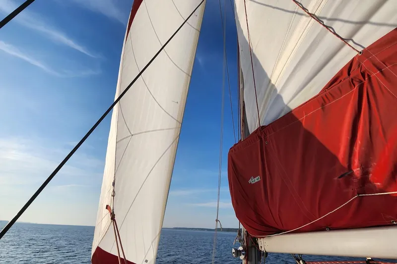 Slide: The Image of Leopard 38 yacht cockpit, 2000 model, featuring sleek seating and table, docked at marina. - 46