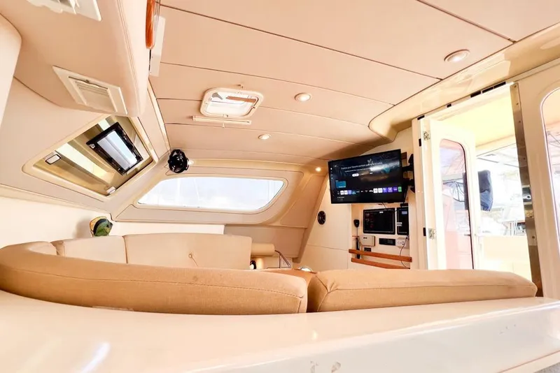 Slide: The Image of Luxurious interior of a 2000 Leopard 38 yacht with modern amenities and cozy seating. - 76